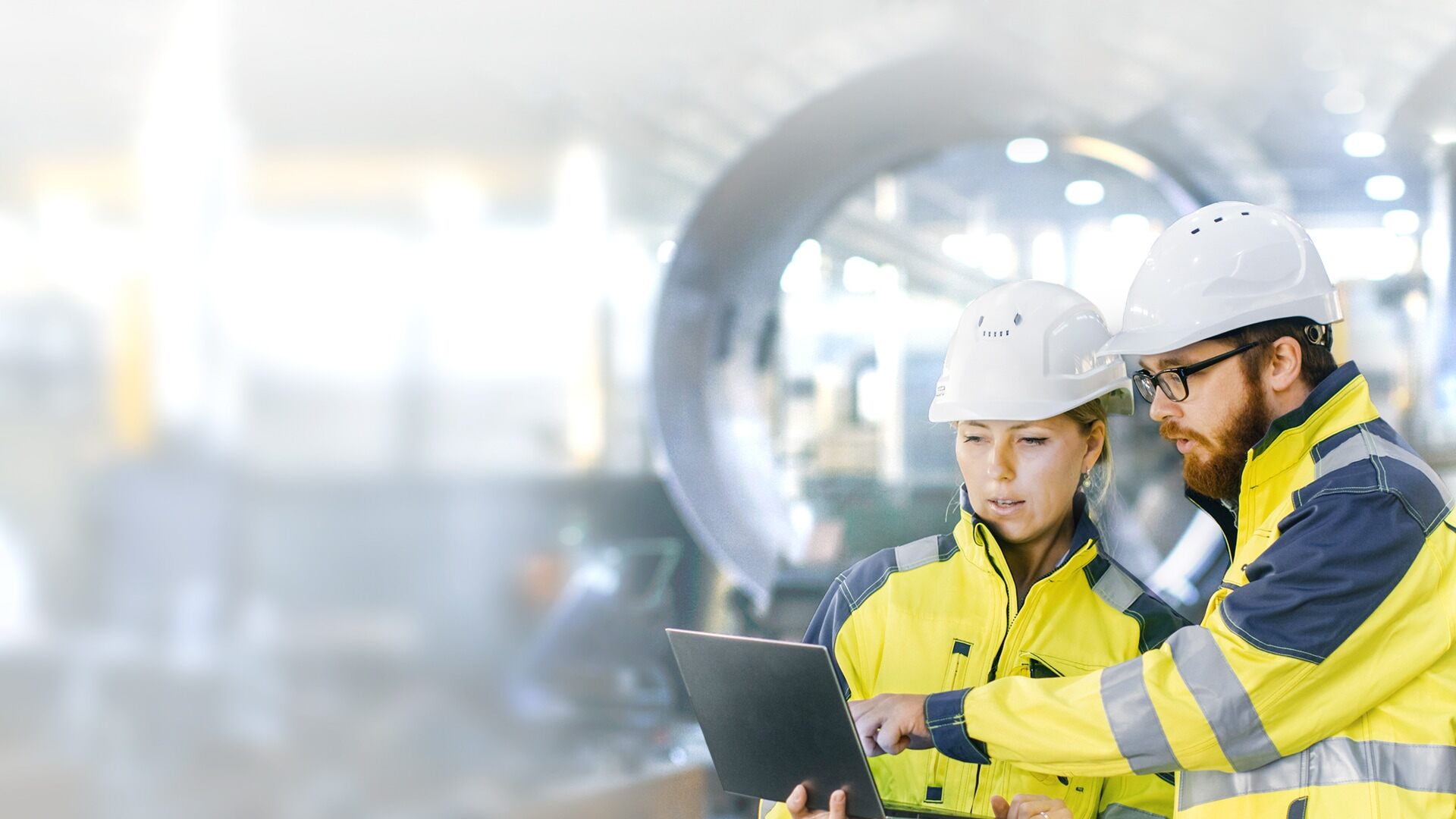 Two Engineers discussing their work