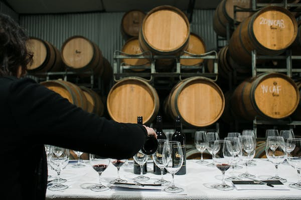 pouring wine in winery