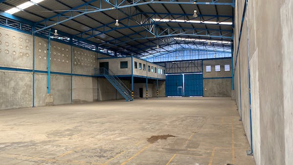 a warehouse with a blue entrance