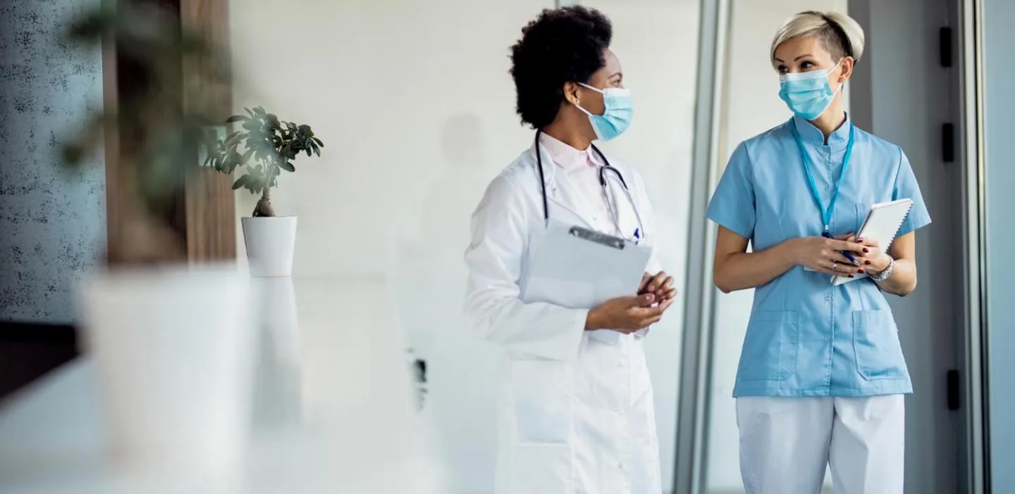Insights Blog 8 Two healthcare professionals discussing plans.