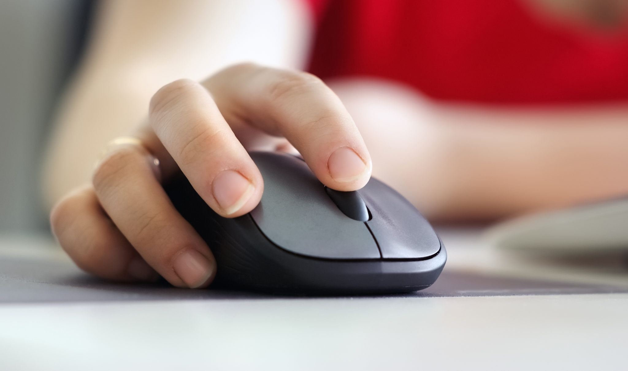 Insights Blog 2 Person using a black computer mouse