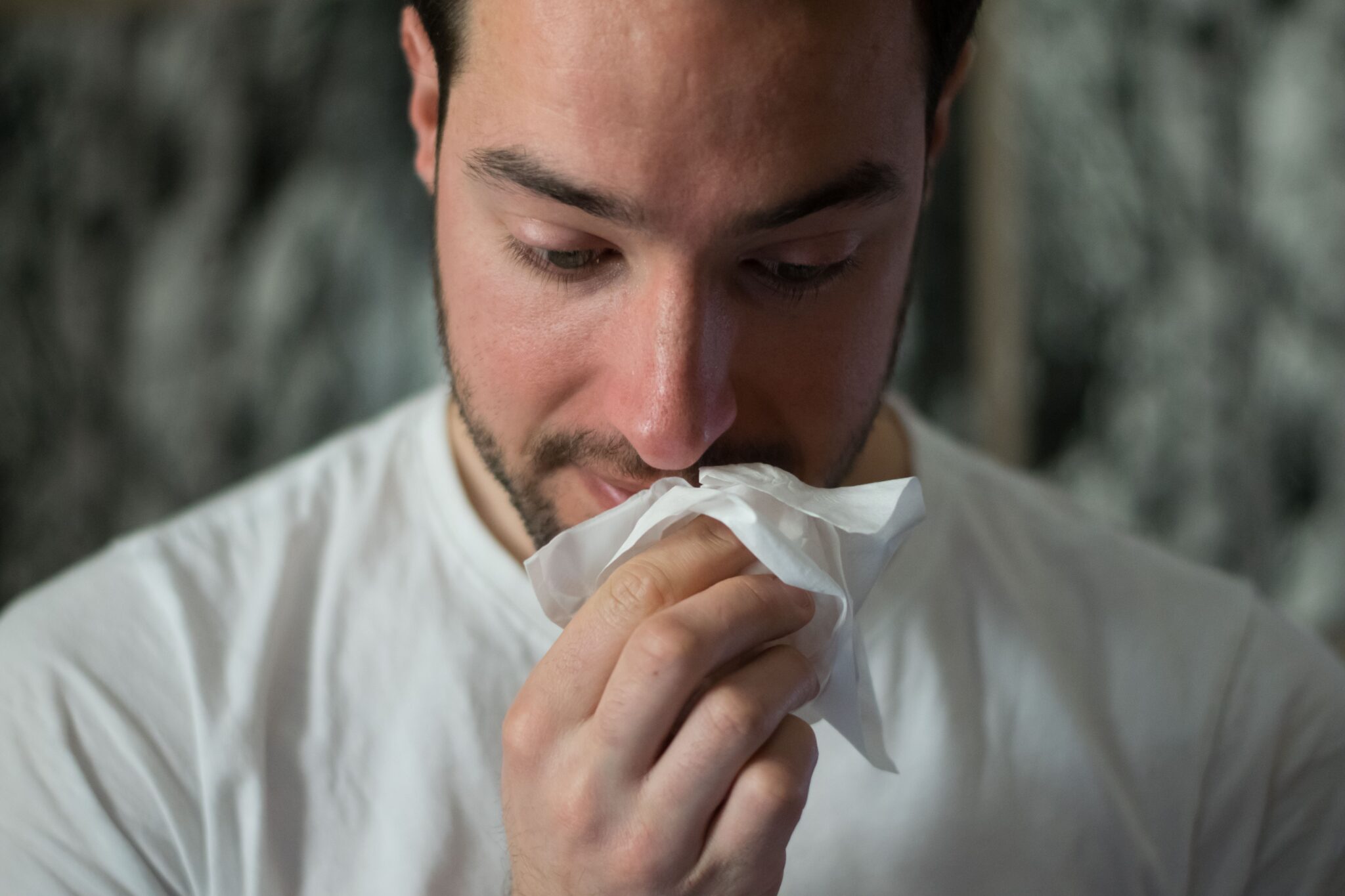 Insights Blog 6 Man holding tissue near his face