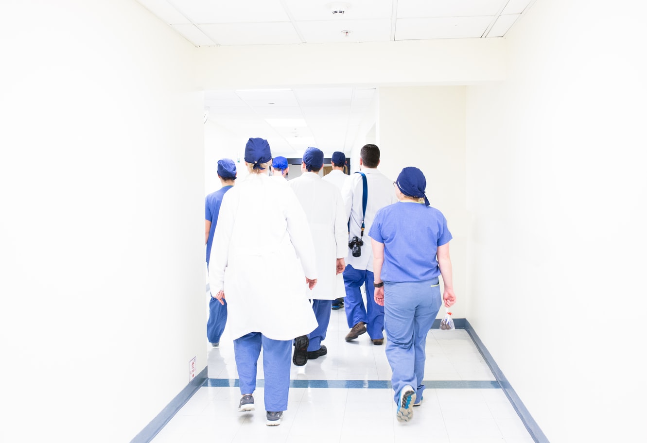 Medical professionals walking down hallway