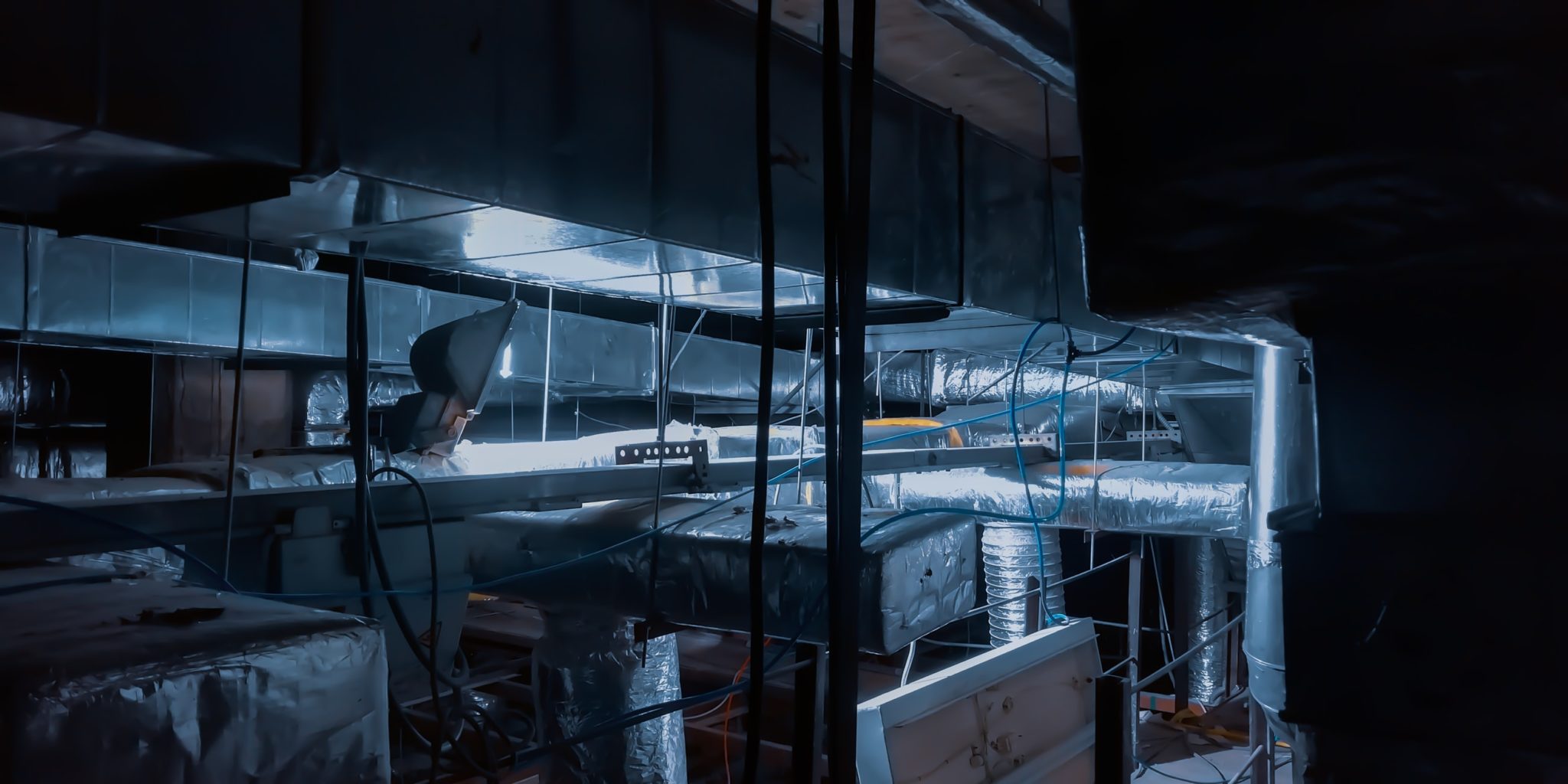 Industrial ductwork in dim lighting