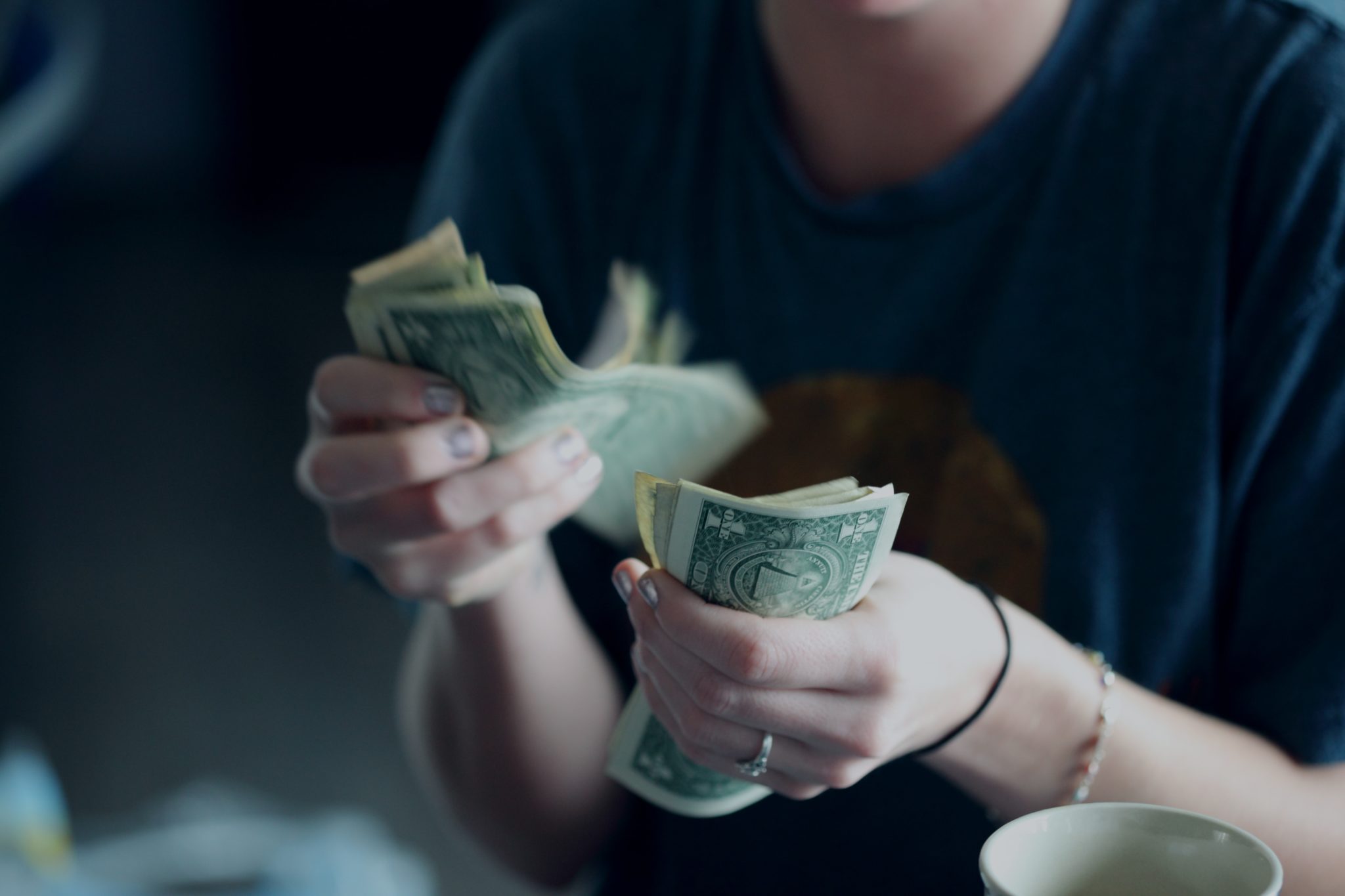 Insights Blog 5 Person counting cash in hands