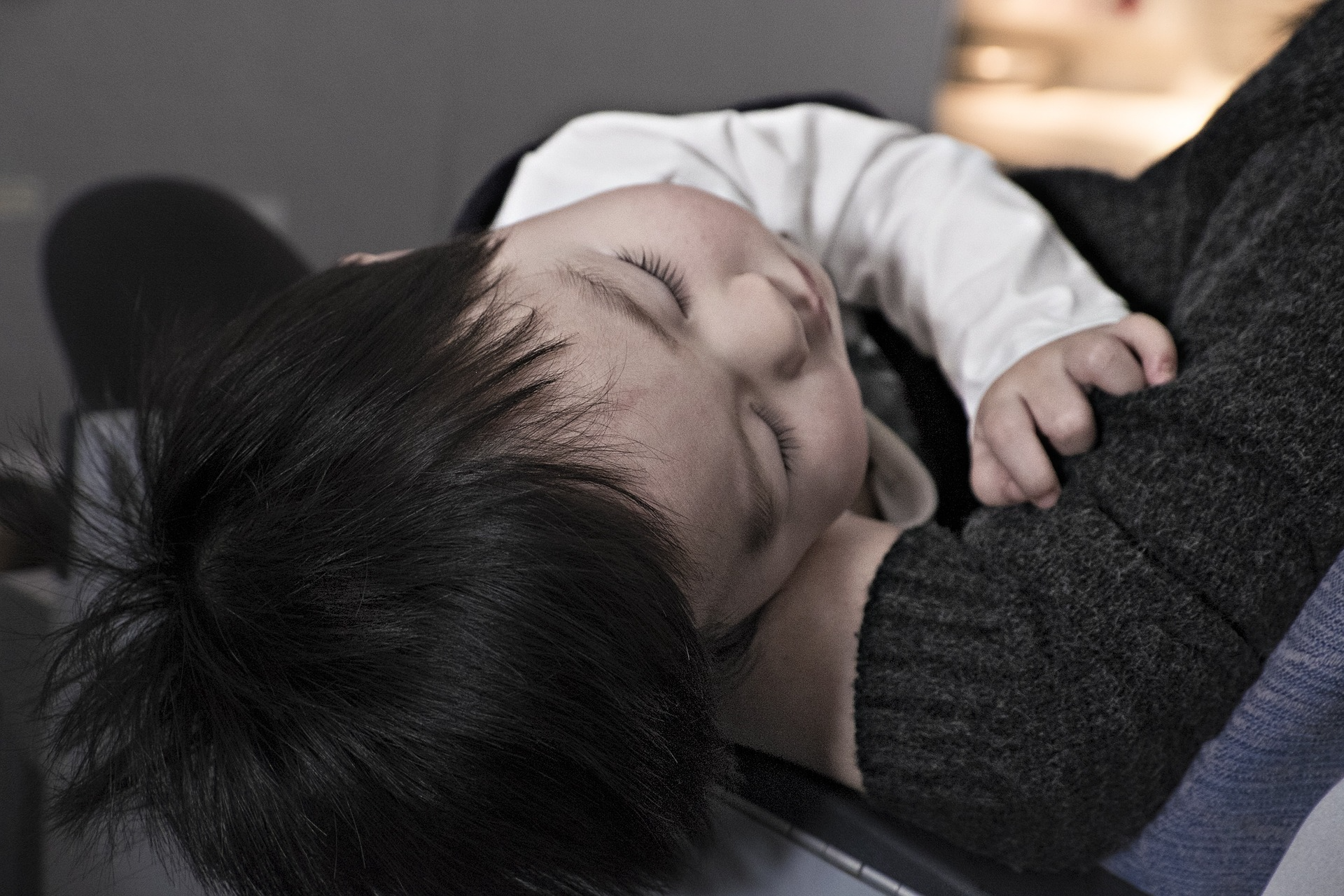 Sleeping child resting on arm
