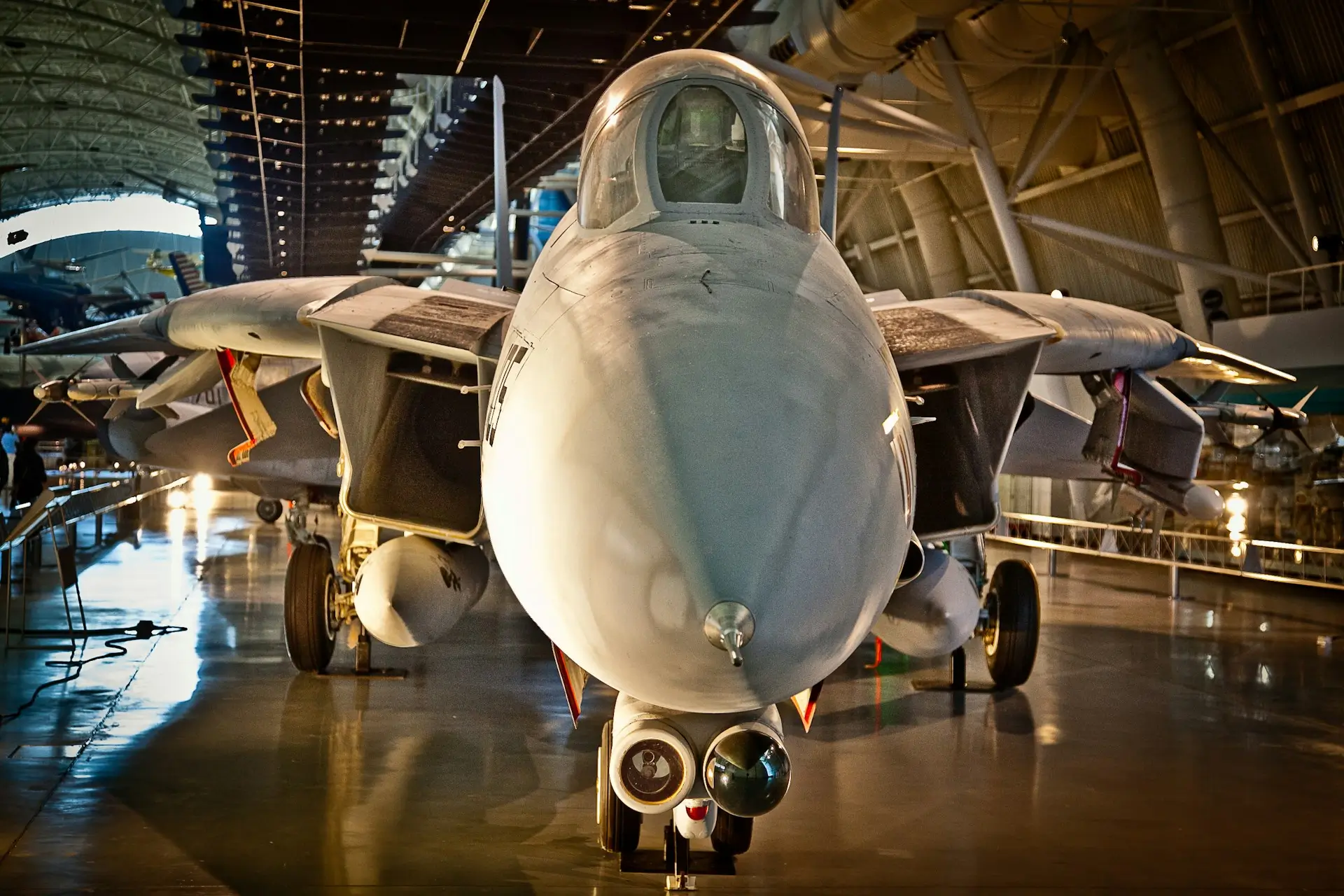 Insights Blog 6 View of a military fighter jet displayed inside a facility.