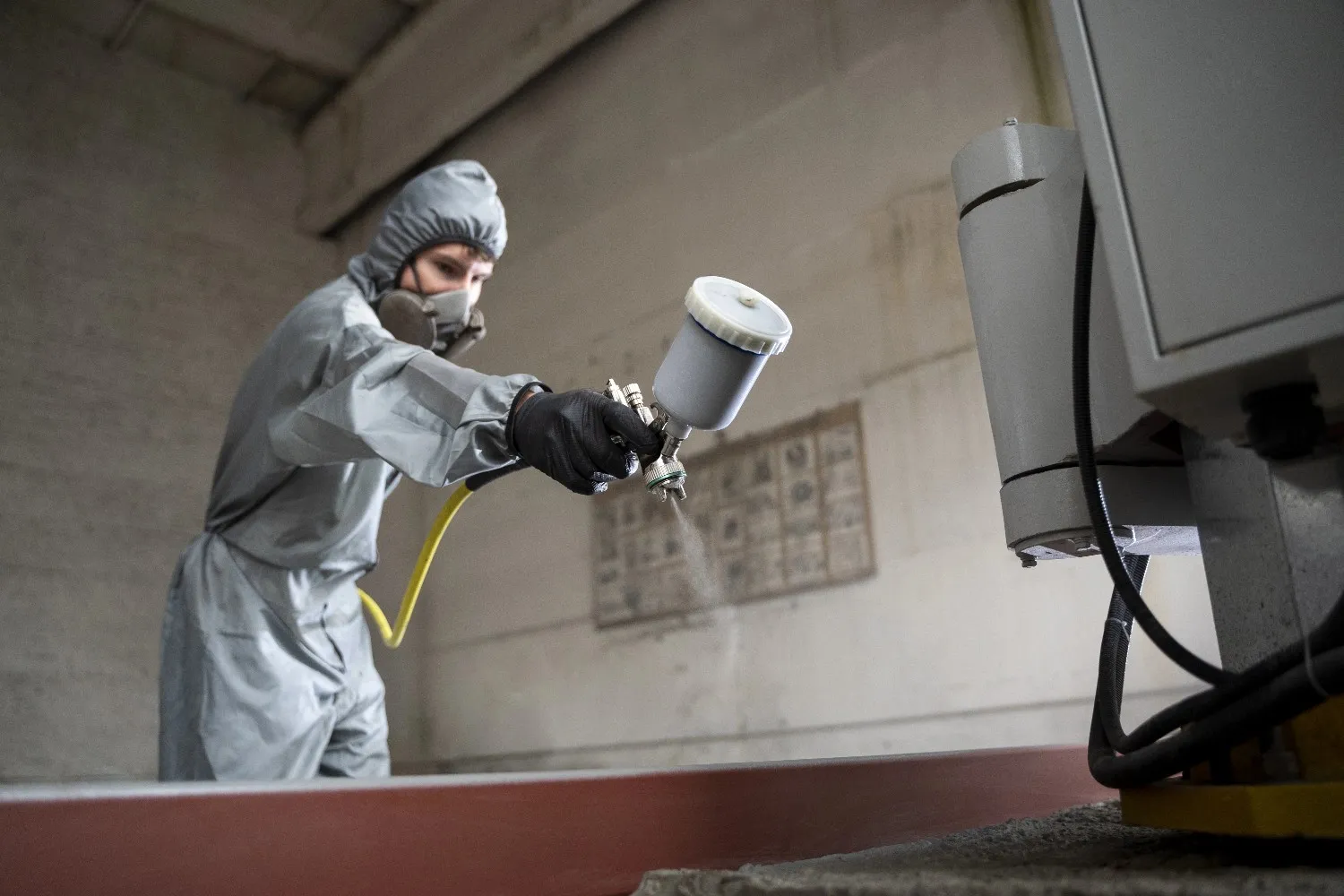 Insights Blog 5 Worker applying paint in booth