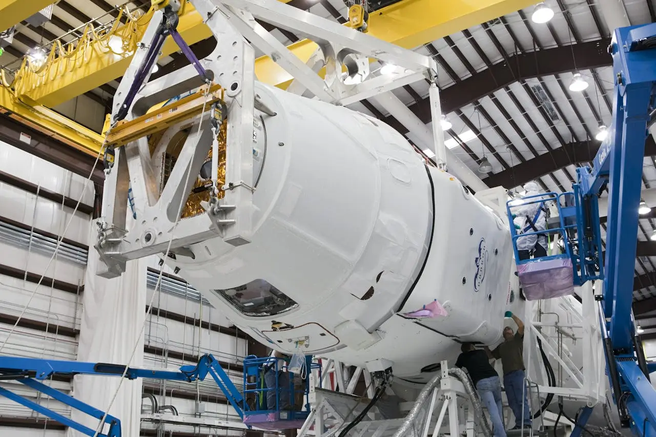 Insights Blog 9 Aerospace assembly facility with large spacecraft module inside controlled manufacturing environment