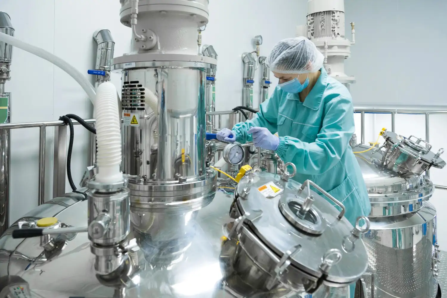 Insights Blog 5 Pharmaceutical manufacturing setup with technician handling equipment, highlighting how environmental conditions like dry air affect product stability.