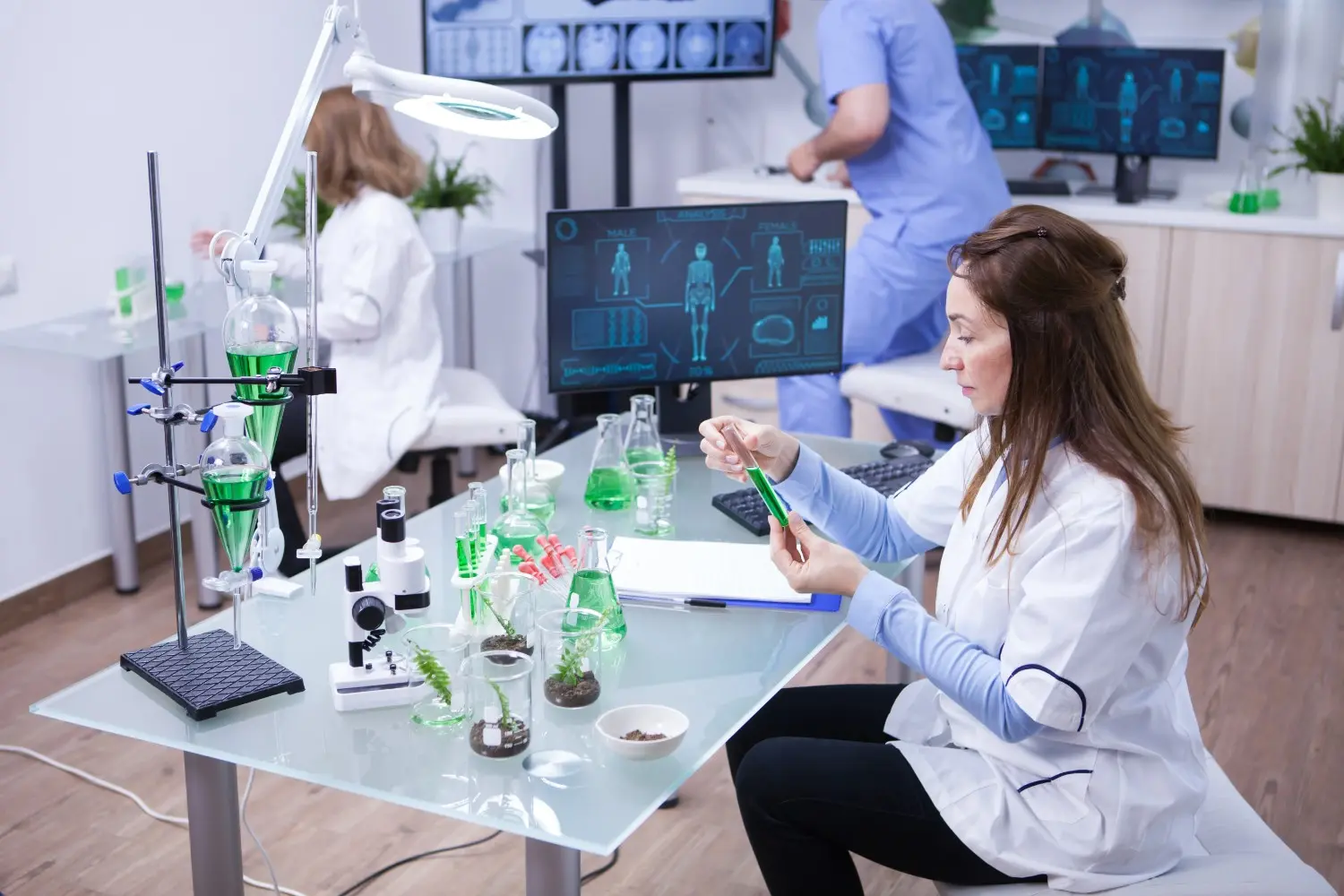 Insights Blog 3 Pharmaceutical researchers working in a laboratory with testing equipment, illustrating controlled environments for safe and reliable production.