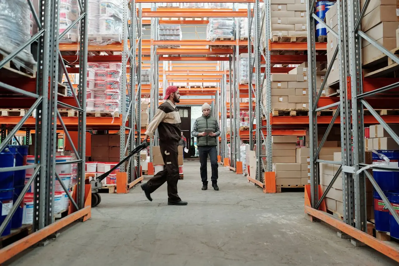 Insights Blog 9 Warehouse workers inspecting inventory in a humidity-controlled storage facility.