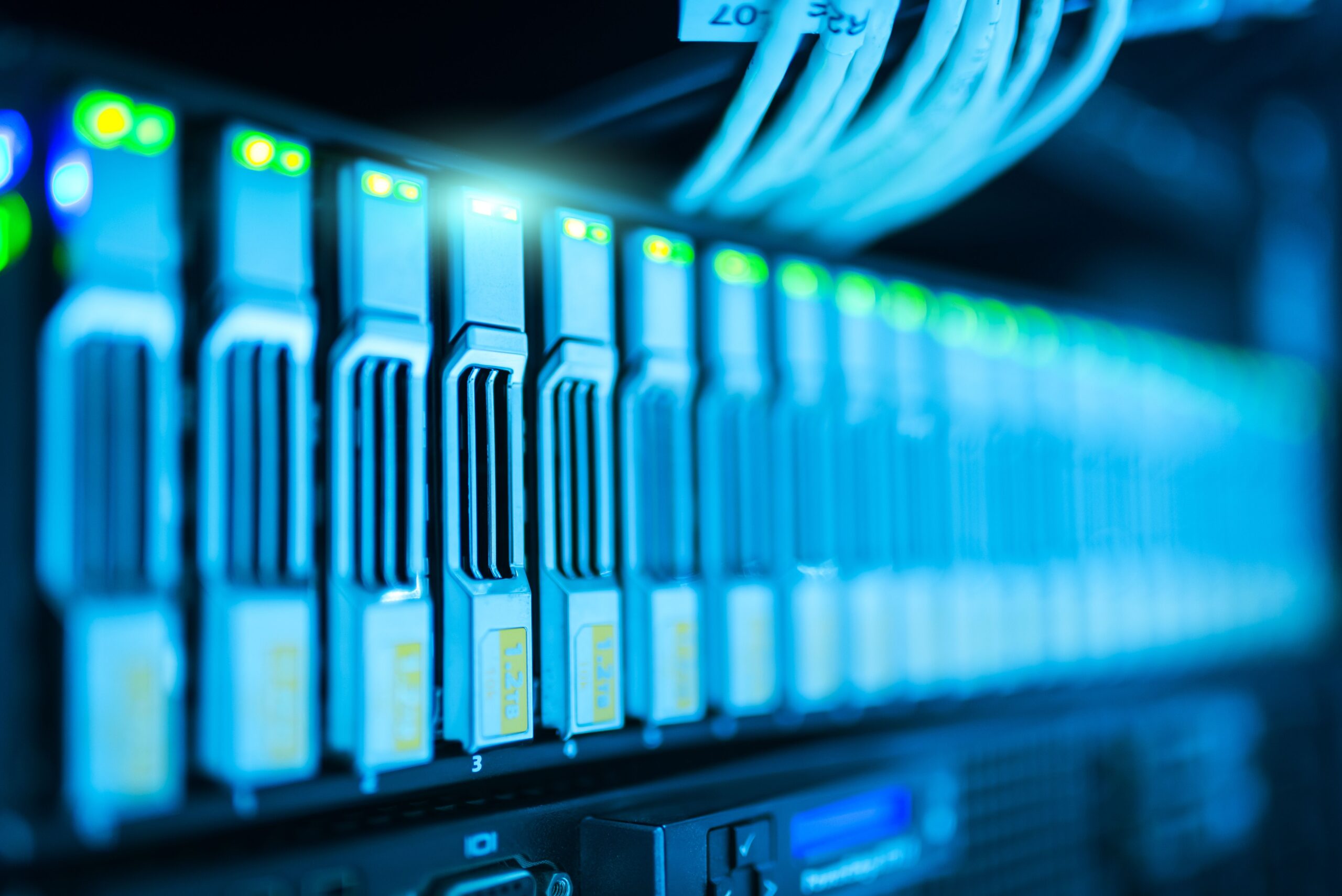Insights Blog 1 Close-up of enterprise data storage drives and network infrastructure inside a server rack, illustrating high-density IT equipment that requires precise cooling and humidity control to maintain reliability and energy efficiency.