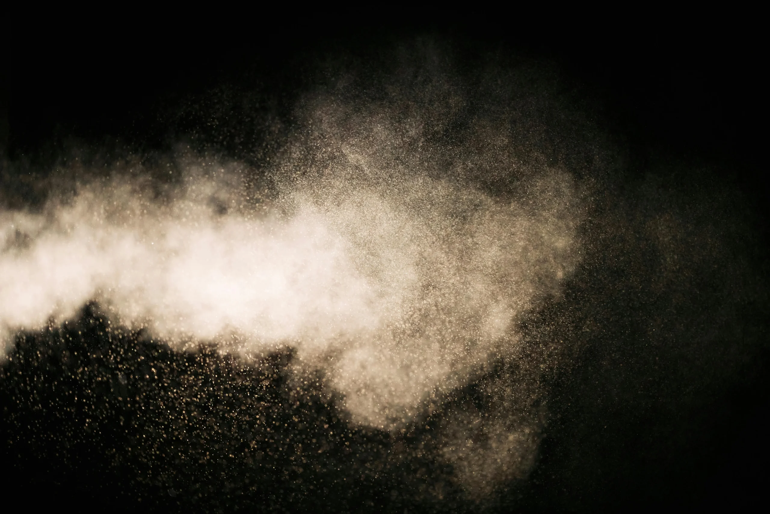 Insights Blog 5 Fine mist created through air atomization, showing uniform water droplets suspended in the air during a twin-fluid fogging process used for industrial humidification, cooling, and dust suppression.