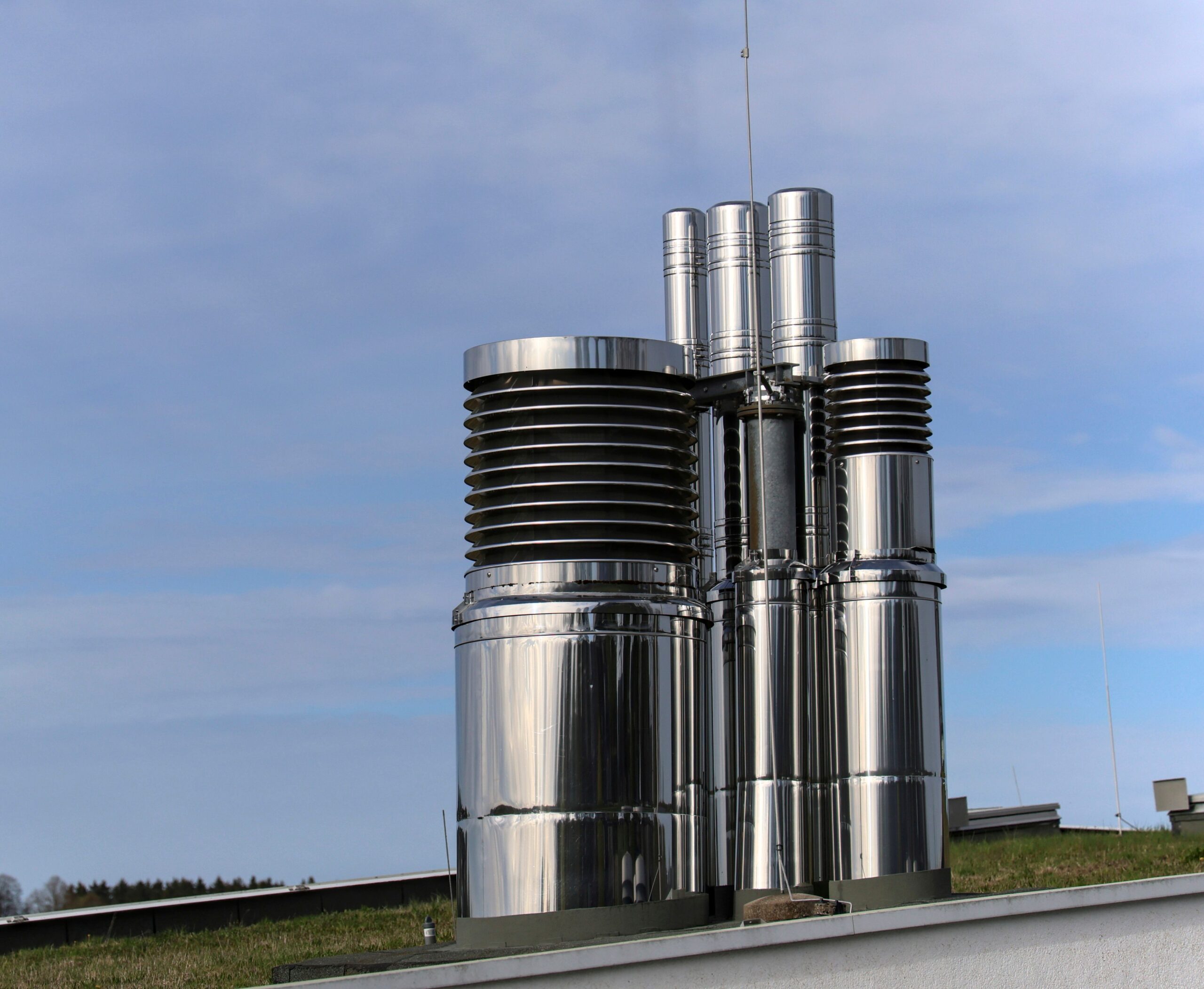 Insights Blog 5 Industrial rooftop ventilation and environmental control units installed on a manufacturing facility, representing infrastructure used to regulate airflow, temperature, and humidity in large industrial environments.