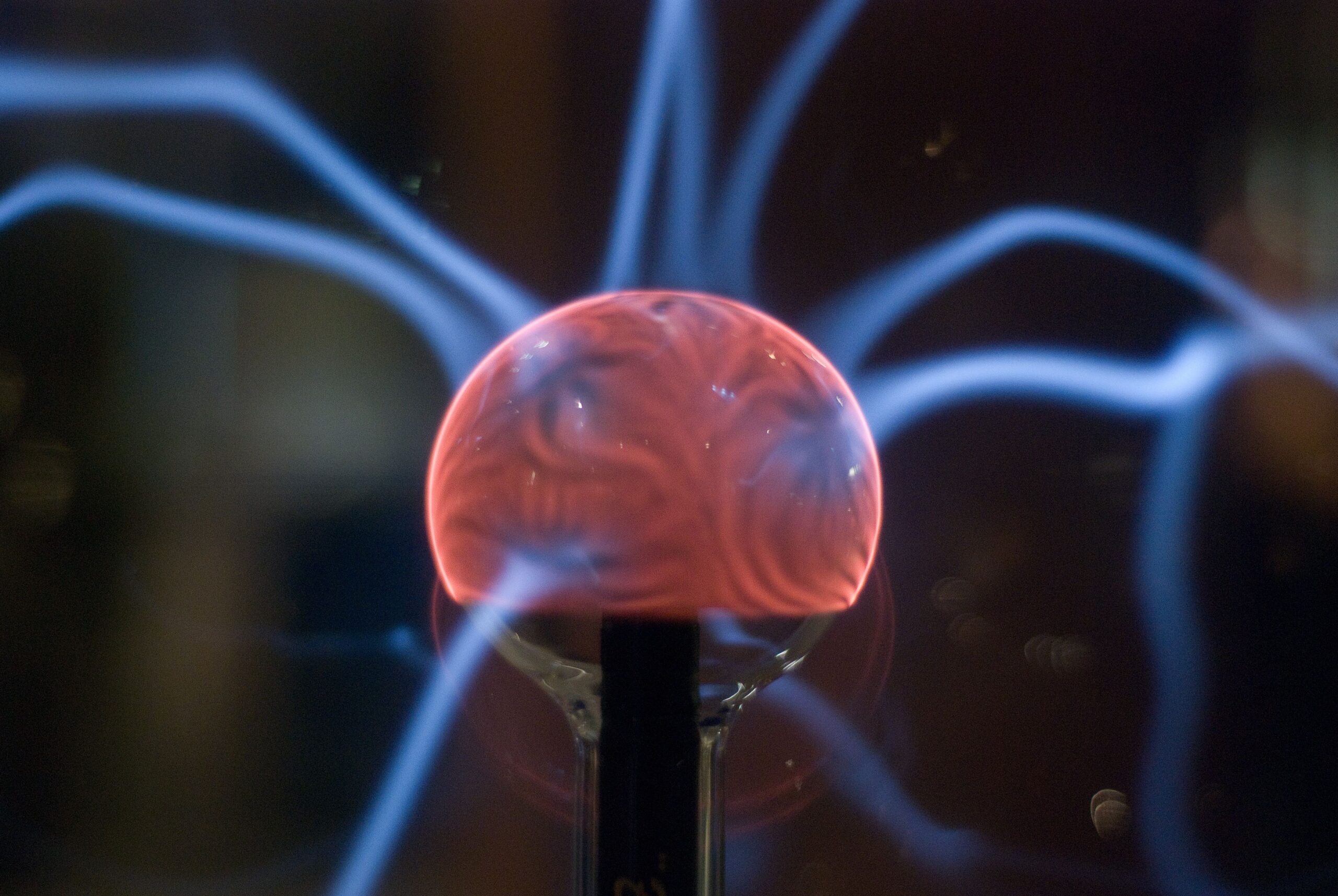 Insights Blog 5 Plasma globe generating visible electrical arcs, illustrating the movement and discharge of static electricity through ionized gas.