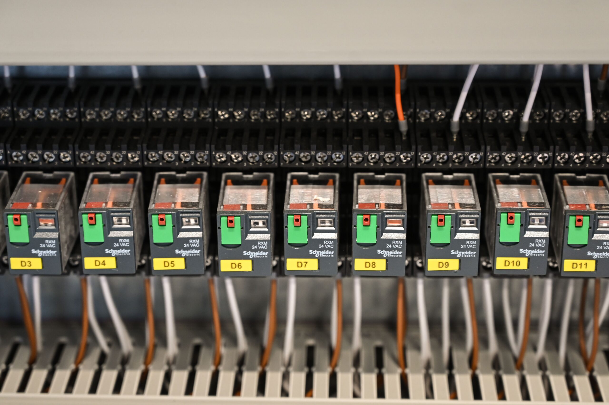 Insights Blog 2 Industrial electrical control panel with relay modules, wiring terminals, and automated control components used in manufacturing and process control systems.