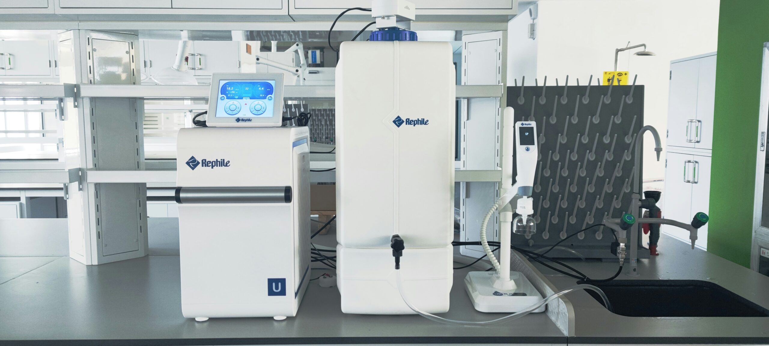 Insights Blog 6 Laboratory-grade water purification and monitoring equipment installed on a laboratory bench, featuring digital controls, dispensing systems, and integrated filtration components used to support precision analytical and research workflows.