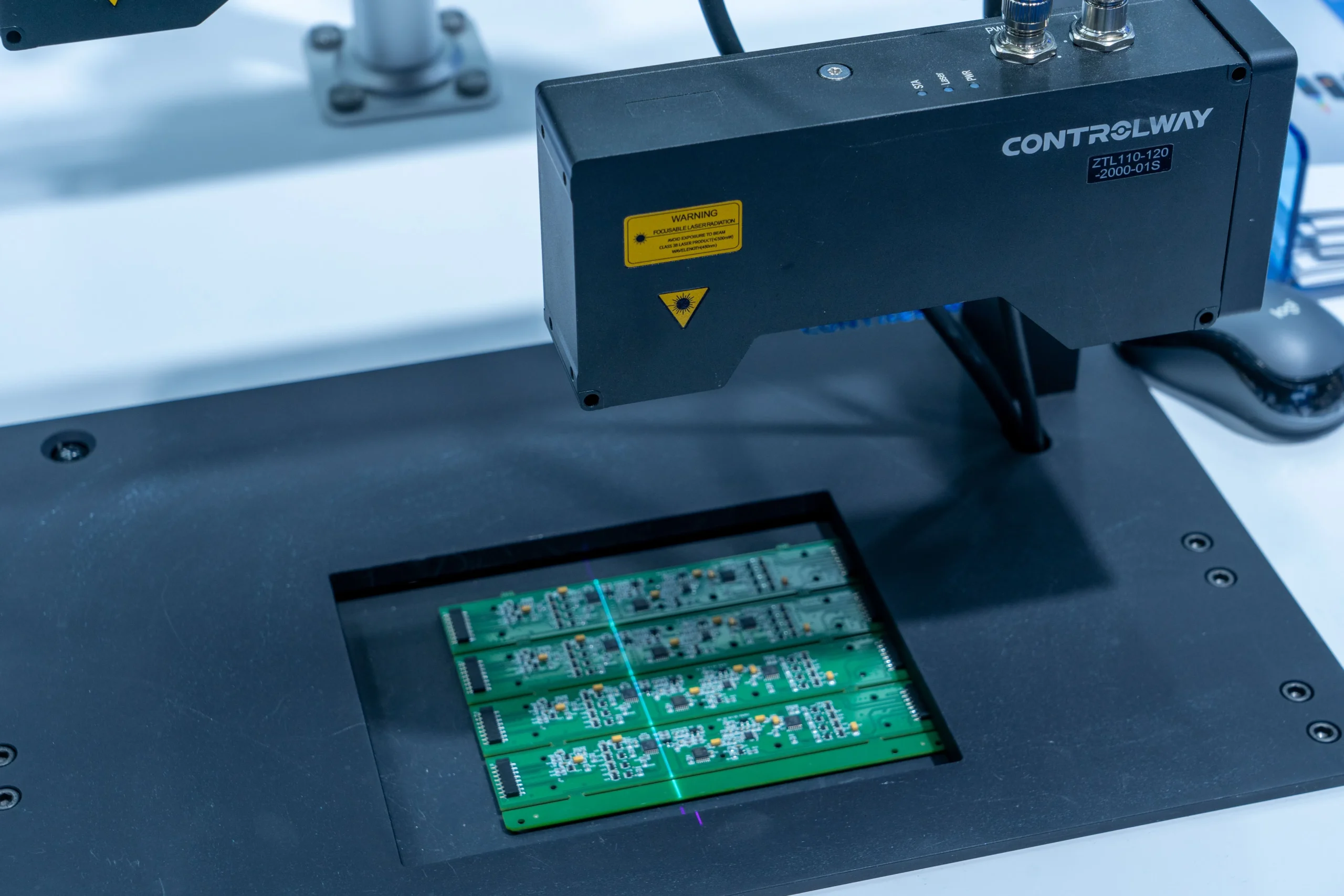Insights Blog 6 Automated PCB inspection system scanning printed circuit boards with a laser for electronics quality control.