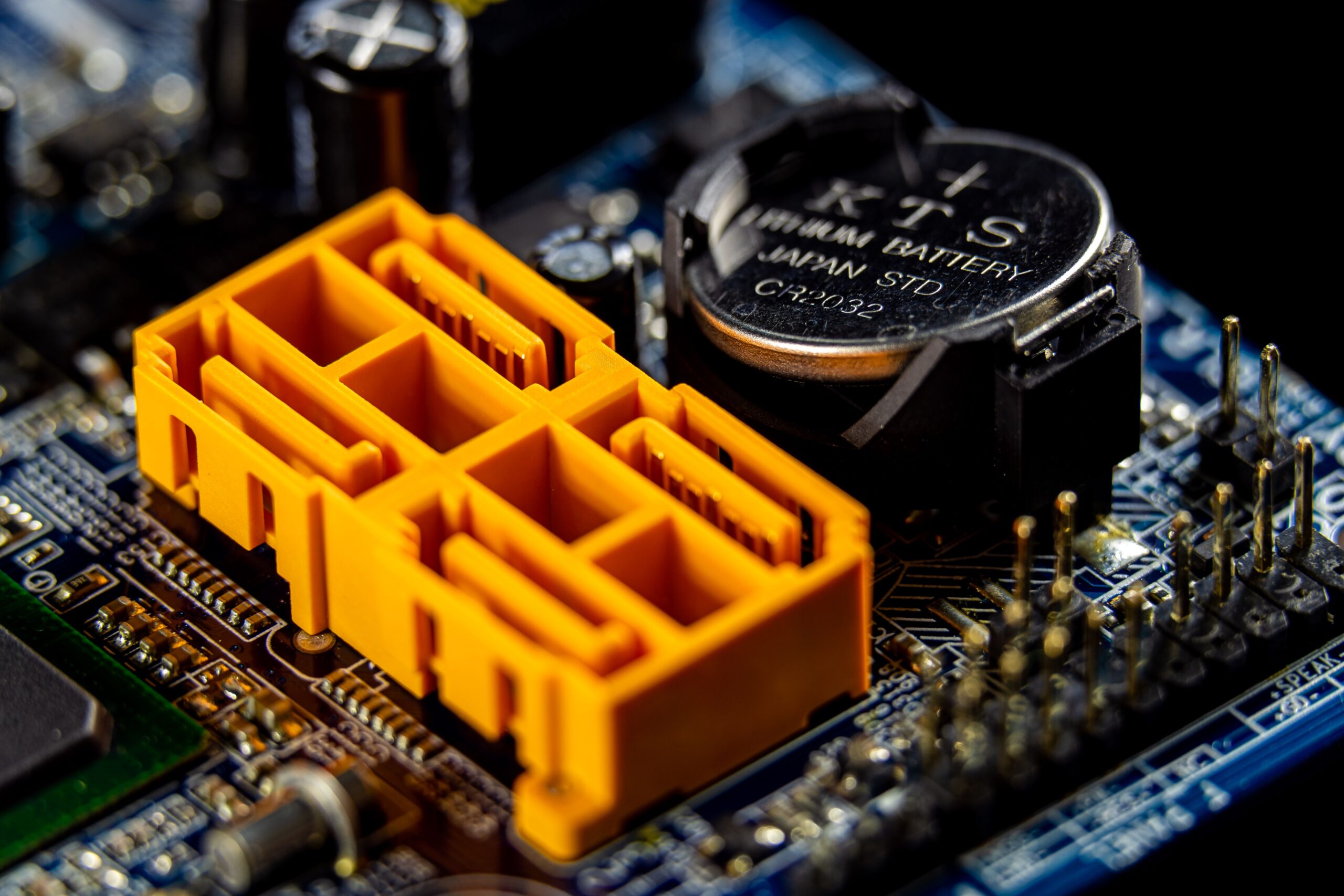 Insights Blog 5 Close-up of ESD-safe electronic components and connectors on a printed circuit board during electronics assembly.