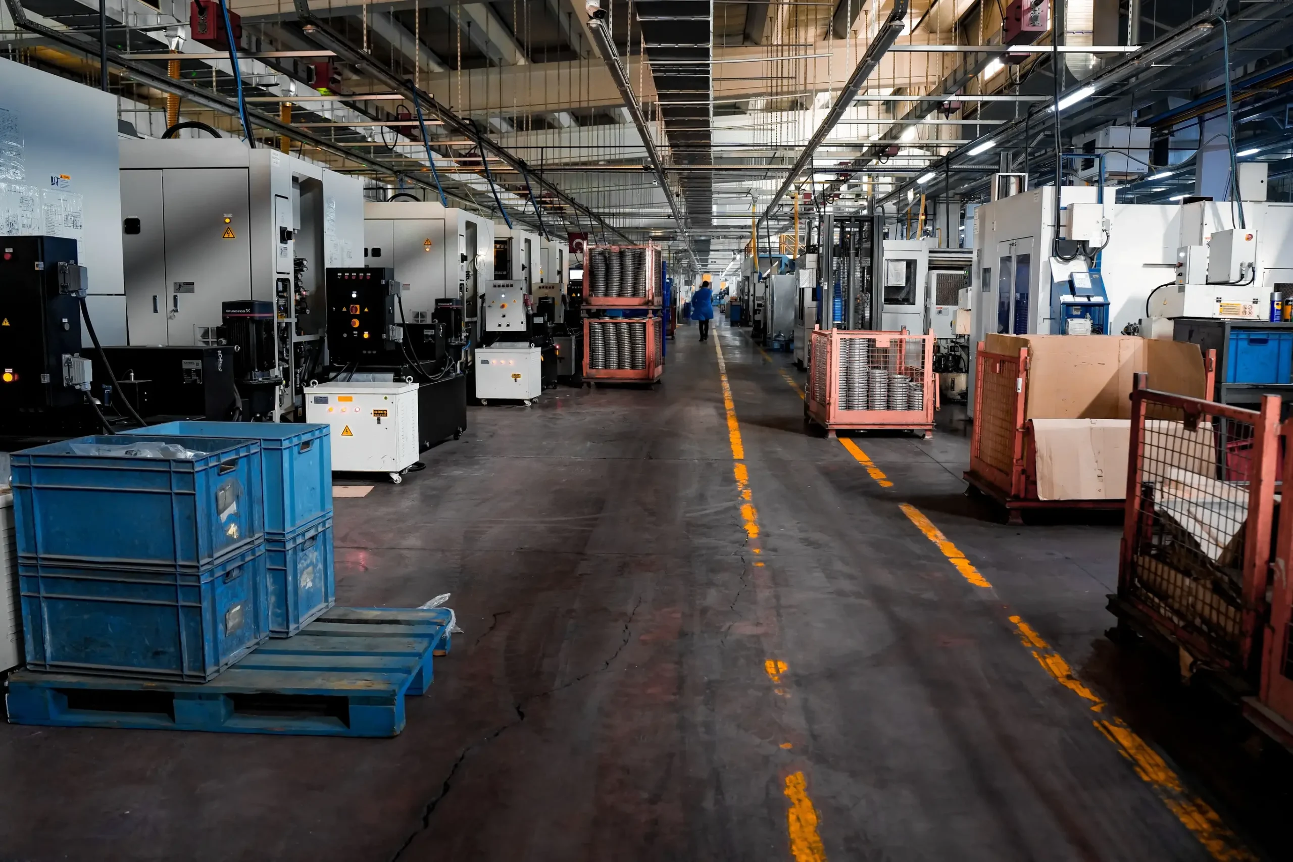 Insights Blog 4 Modern industrial manufacturing facility with automated production equipment and machining lines, representing environments that benefit from precise humidity control to reduce static, protect materials, and improve operational efficiency.