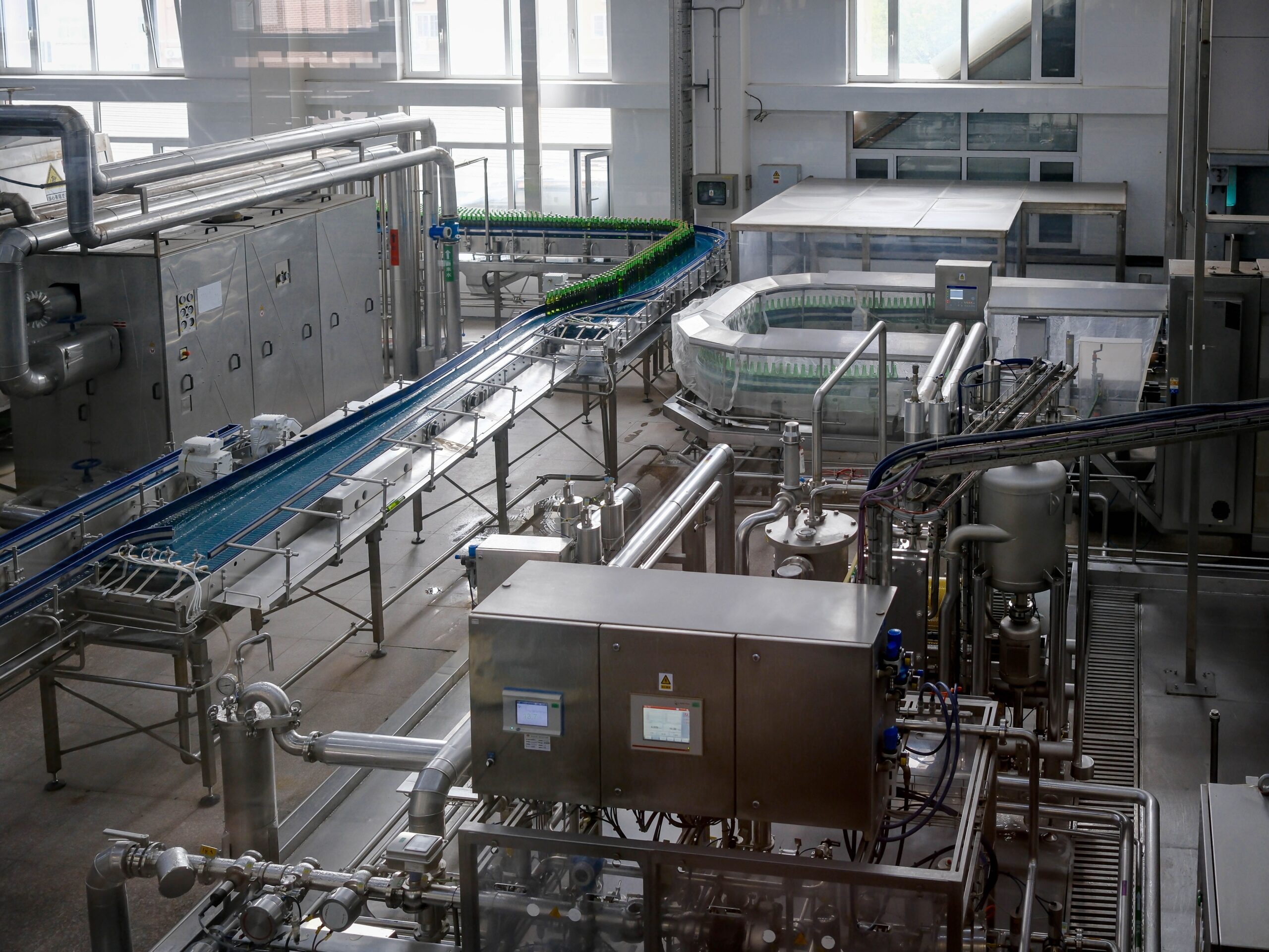 Home Page 2 Complex industrial machinery in a modern factory, representing the varied facility environments where dew point and relative humidity govern different categories of moisture risk
