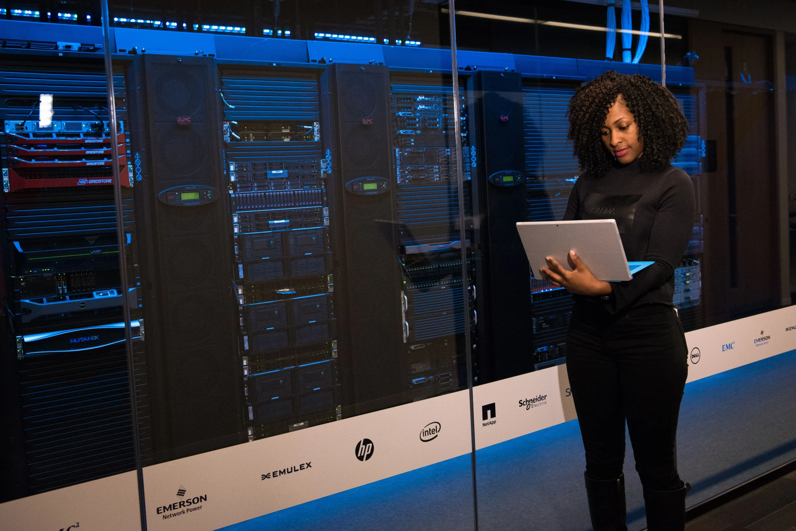Home Page 8 Server racks in a data center corridor, representing the high-risk zones where dew point must be monitored at rack inlet air paths to prevent condensation on hardware