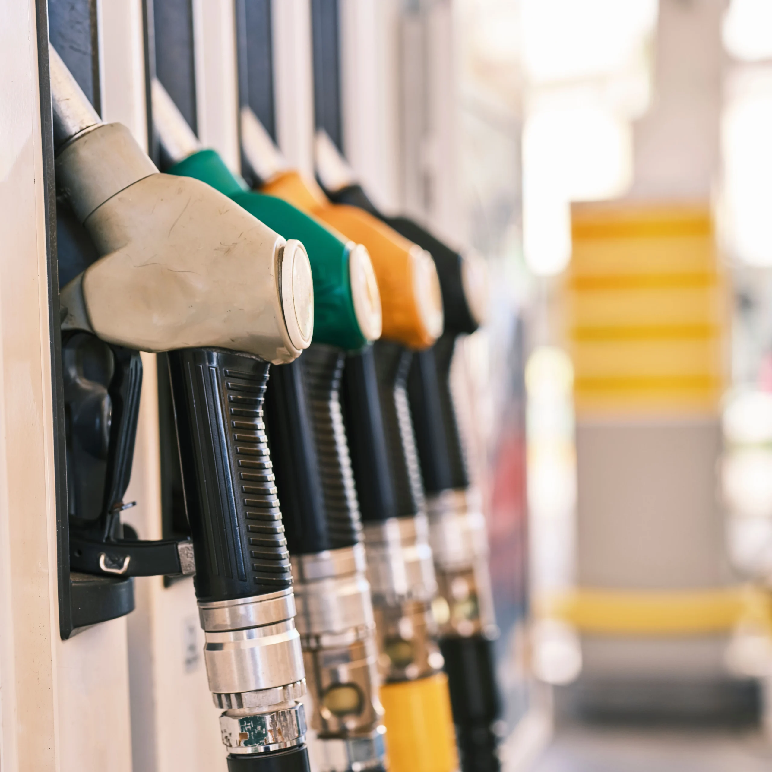 Insights Blog 7 Close-up of fuel pump nozzles at a gas station, illustrating the fueling scenario where static electricity discharge can ignite flammable vapor