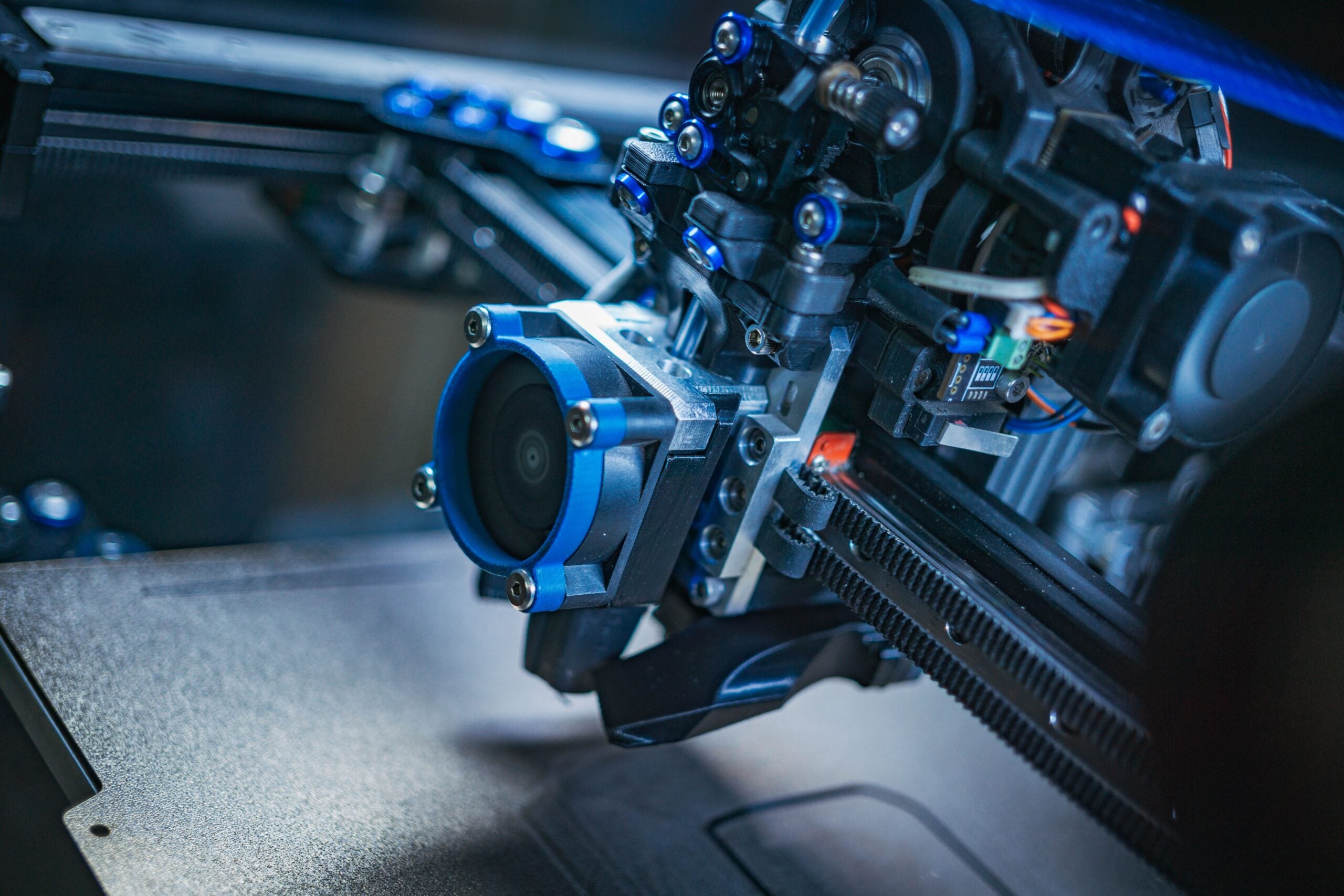 Insights Blog 3 Close-up of precision manufacturing equipment with mechanical belts, gears, and electronic components, representing the high-speed industrial processes and sensitive electronics vulnerable to static charge buildup