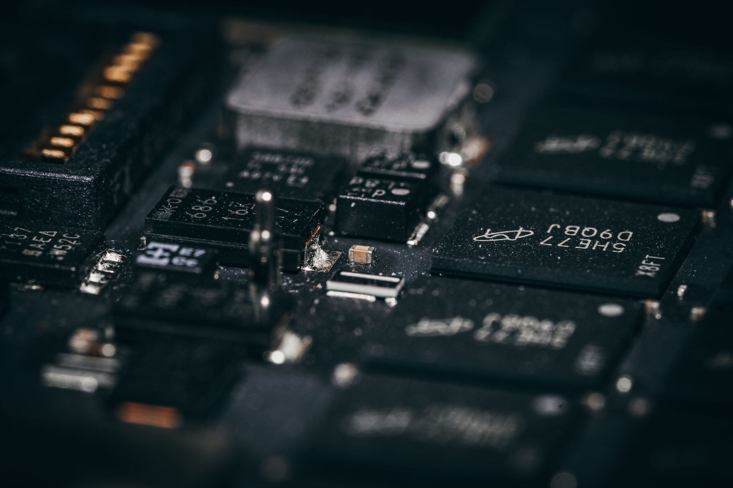 Insights Blog 1 Close-up of a circuit board's electronic components, illustrating the type of hardware vulnerable to electrostatic discharge damage