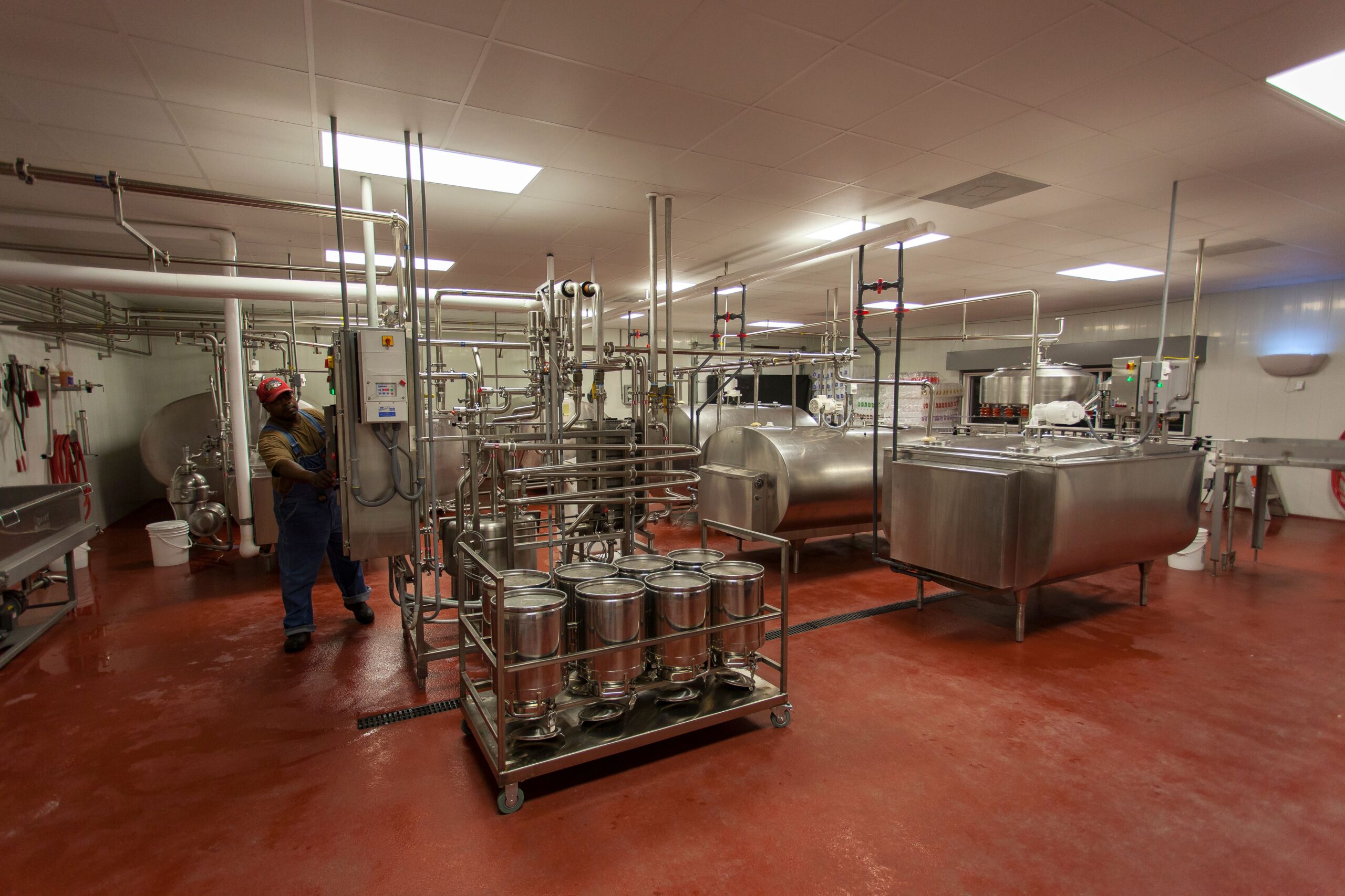 Insights Blog 8 Modern industrial facility with control panel and stainless steel equipment, representing the monitoring systems used to track dew point and prevent condensation risk