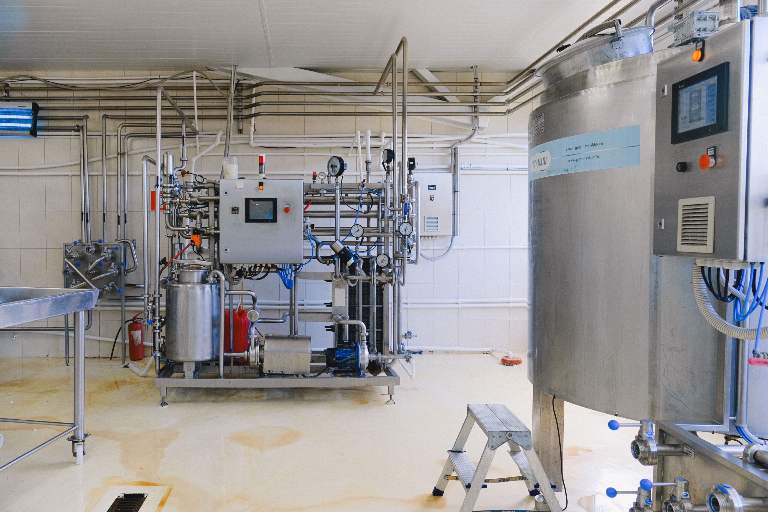 Insights Blog 7 Modern industrial facility with stainless steel piping and equipment, representing the type of infrastructure vulnerable to condensation from high dew point conditions