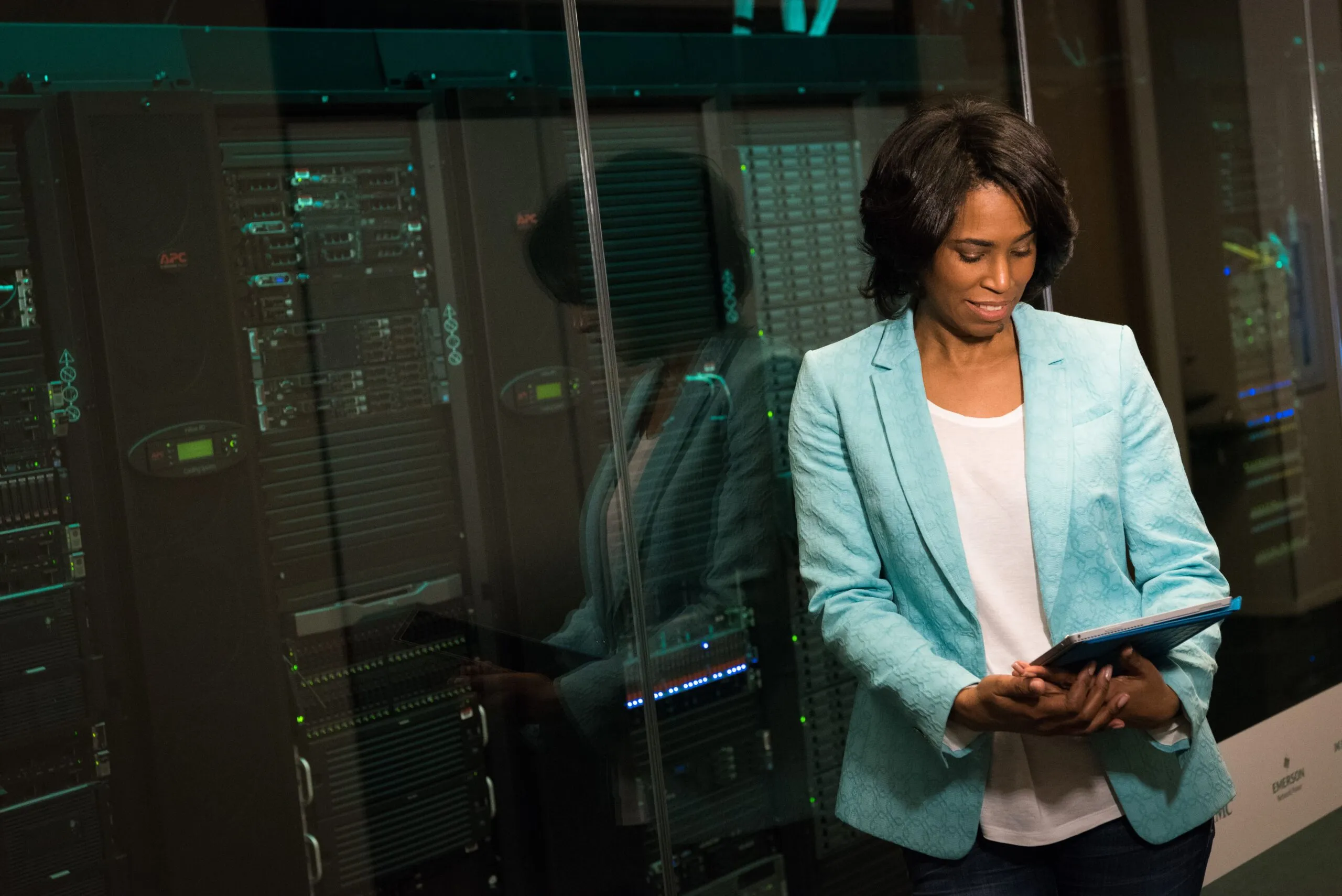 Facilities professional checking server room conditions on a tablet, supporting ASHRAE humidity monitoring and compliance documentation