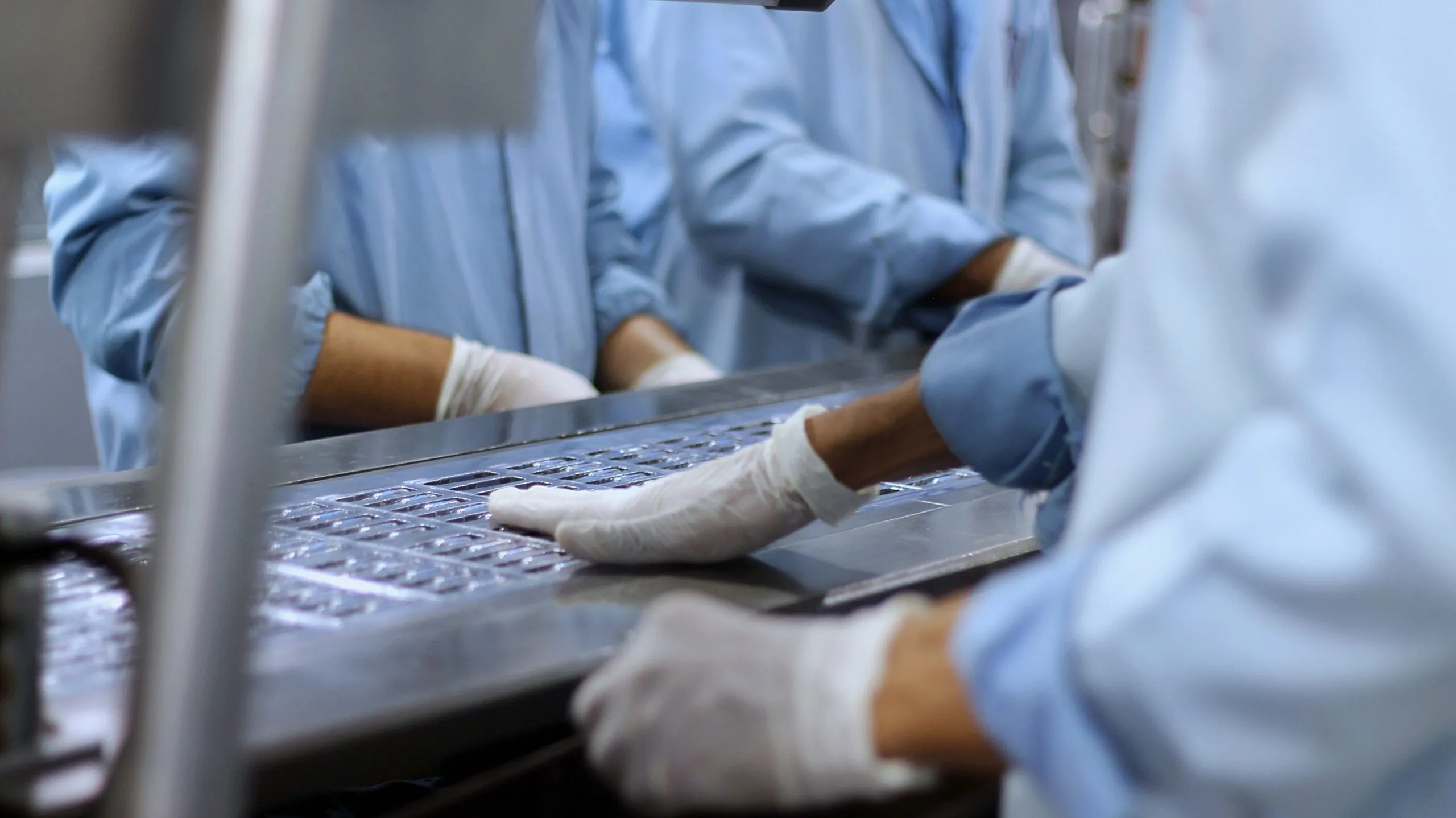 Insights Blog 7 Healthcare workers handling clinical equipment in a controlled medical environment where humidity management can support infection control and help reduce airborne virus viability.