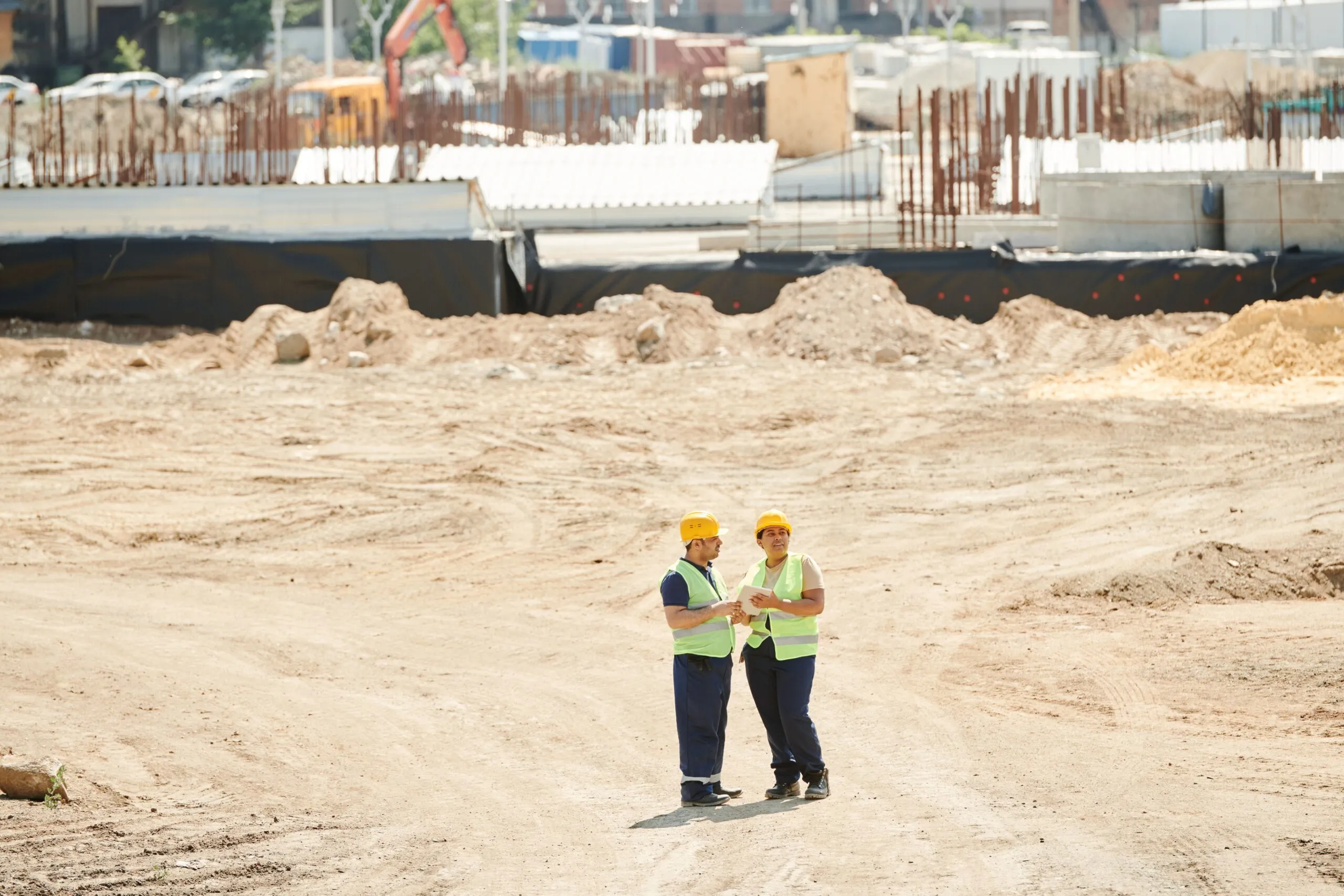 Construction workers on a sun-exposed job site.